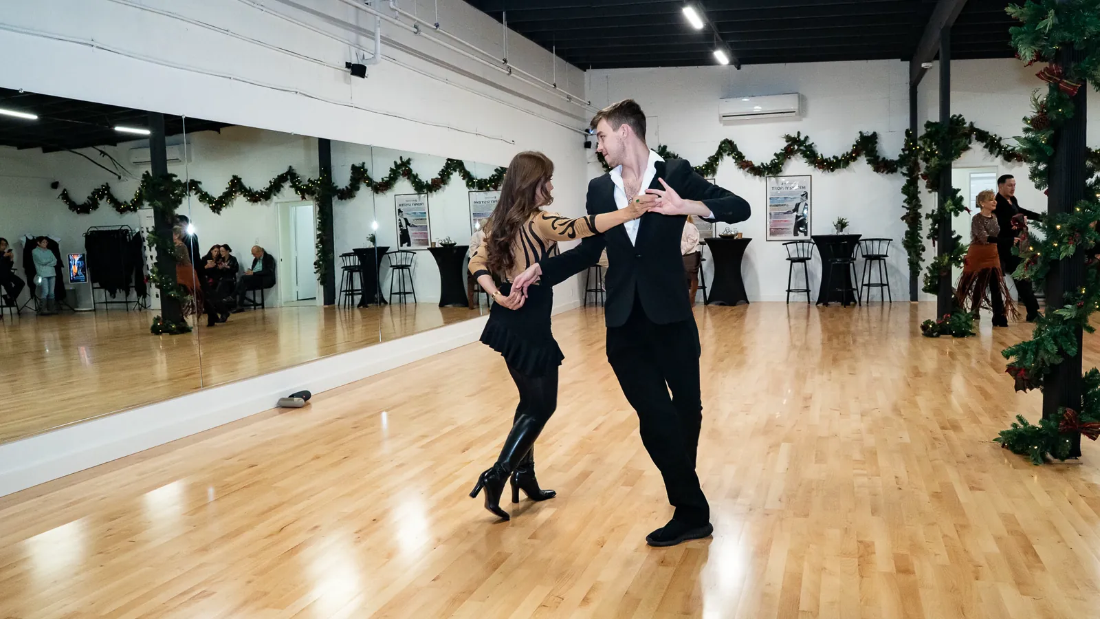 A couple practices ballroom dancing on the studio floor at Fred Astaire Dance Studios Alhambra.