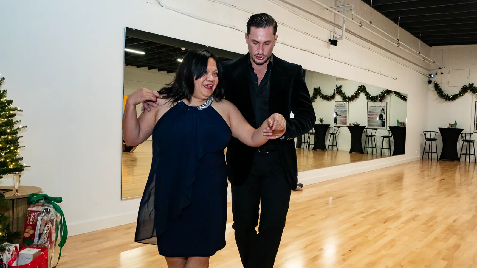 An instructor guides a student through a private dance lesson at Fred Astaire Dance Studios Alhambra.